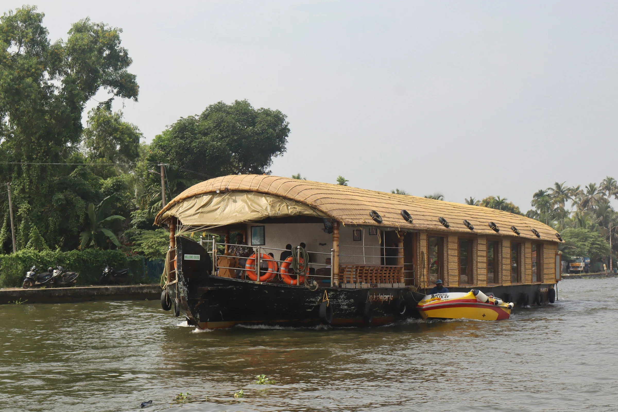 A thatched houseboat on a backwater river