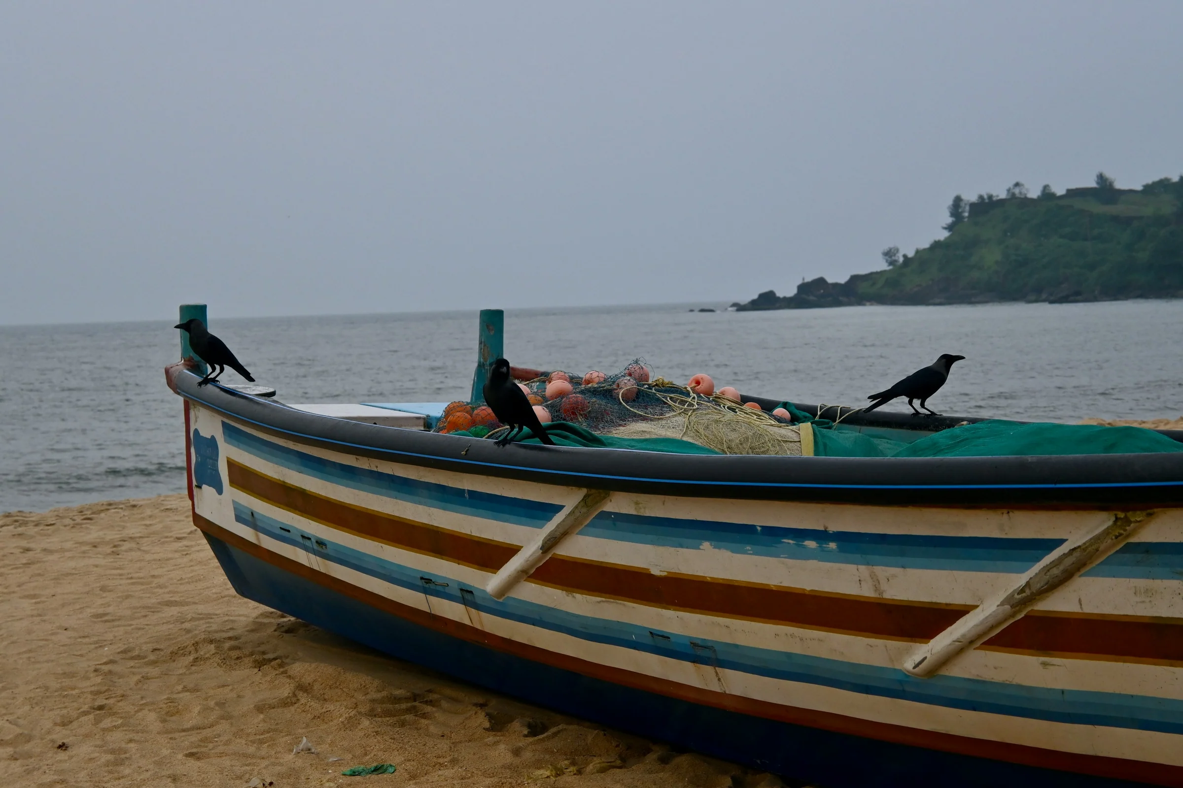 A fishing boat on a beach in Kasaragod district