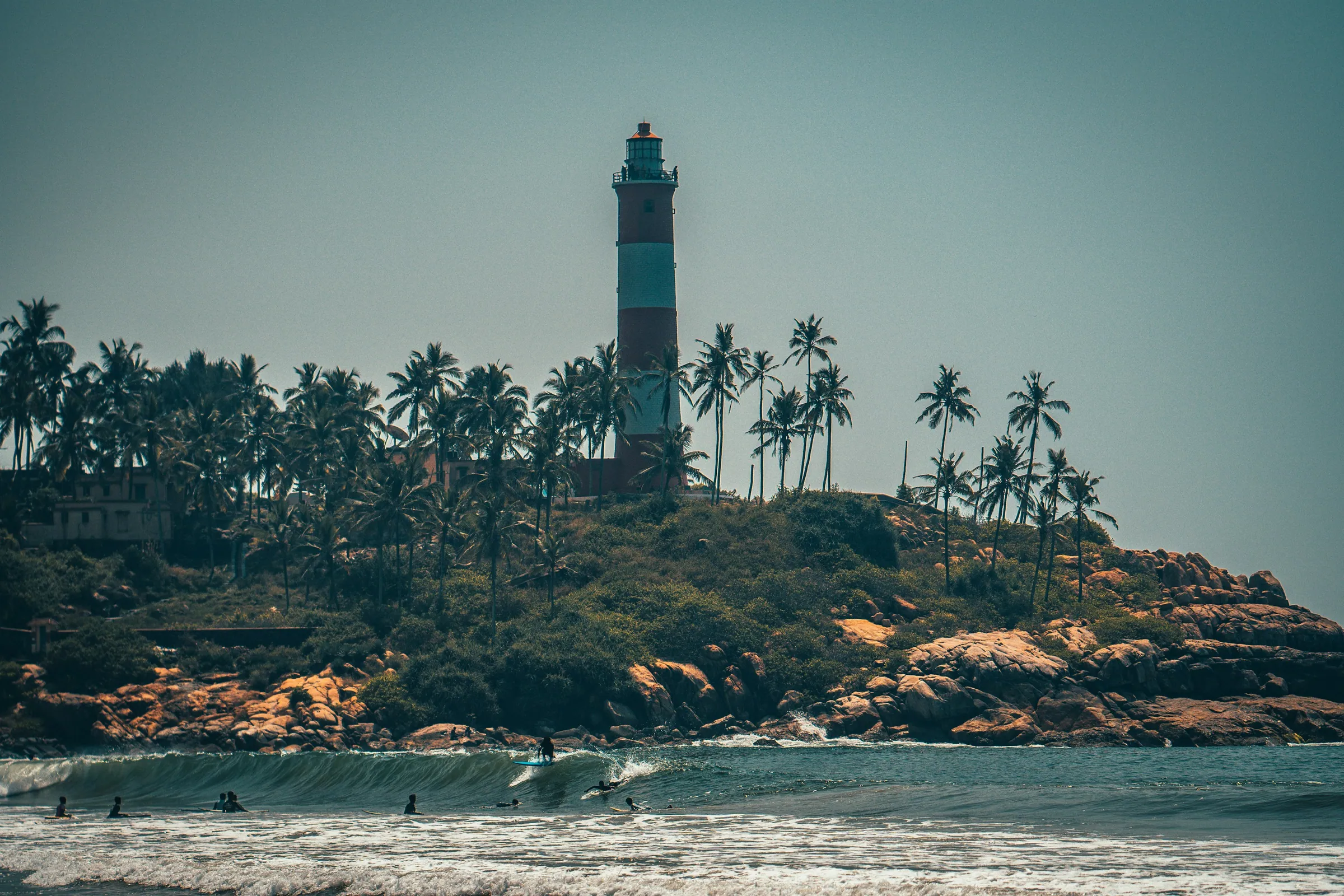 The lighthouse above the rocks at Kovalam